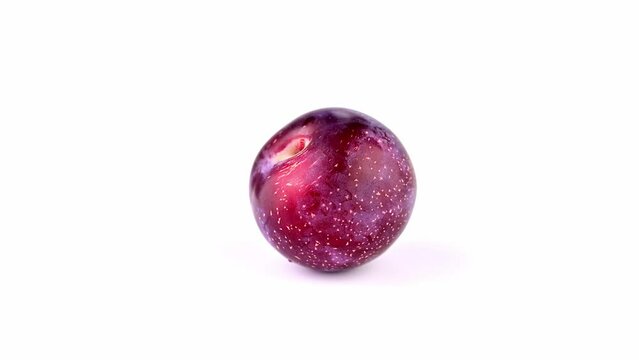 plums isolated on white
