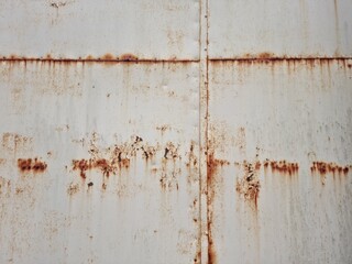 old rusted metal wall section on abandoned building