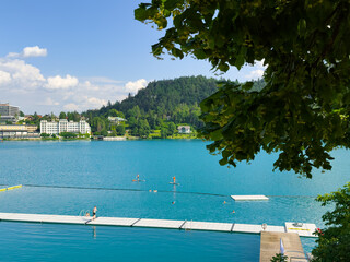 top view of swimming people silhouettes in the Bled lake