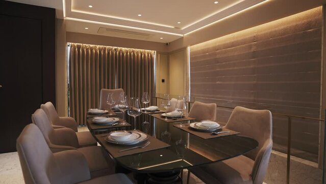 Dining room interior with luxury table and chairs. Real estate shot of interior comfortable and elegant dining table. 
