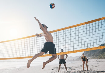 Man, jump and volleyball in air on beach by net in sports match, game or competition. Body of male person jumping for ball in volley or spike in healthy fitness, energy or exercise by the ocean coast - obrazy, fototapety, plakaty