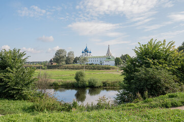 16,08,2020 Russia Suzdal city view, ancient churches against the backdrop of green meadows and blue sky. High quality photo