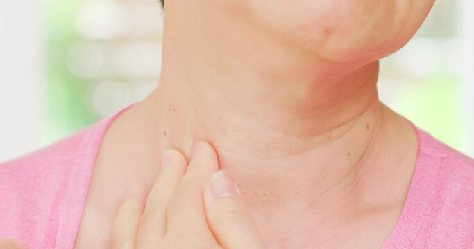 senior woman check thyroid gland