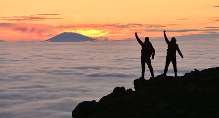 Friends Celebrating Victory at the Summit