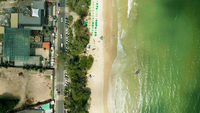 4K Cinematic nature aerial footage of a drone flying over the beautiful beach of Patong in Phuket, Thailand on a sunny day