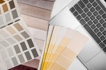 different types of fabrics with a color palette and laptop
