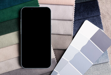 a variety of fabrics with a color palette and phone