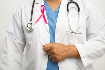 Breast cancer, Asian doctor woman with pink ribbon, symbol of World Breast Cancer Day.