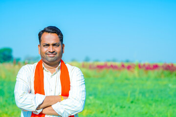 Fototapeta na wymiar young indian farmer showing agriculture field.