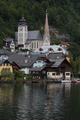Fototapeta na wymiar lakeside village surrounded by mountains, Austria
