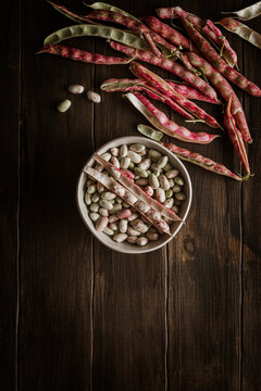 Cranberry beans. Borlotti beans in bowl. Beans pods.
