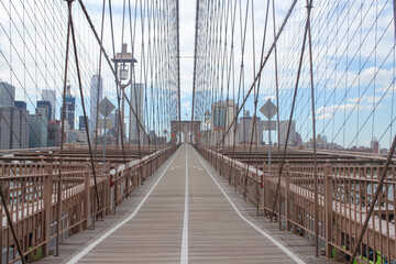 The famous Brooklyn Bridge is empty in the morning.