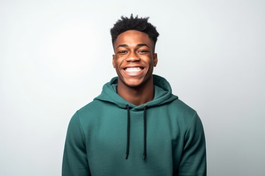 Portrait of a smiling african american man in green hoodie