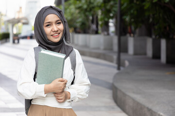 Student's Path to Knowledge. Modern Asian Muslim Woman Embracing Education and Getting Back to...