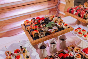 Big buffet reception of different delicious food at a wedding celebration. Snacks for guests....