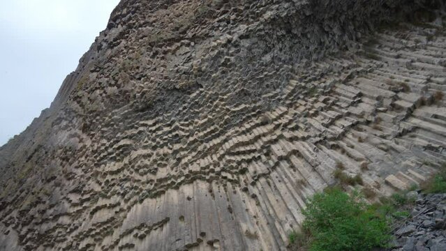 Symphony Stones, Garni village. Armenia. Bottom-up view of polygonal structure of basalt columns in Garni Gorge. Well-known natural monument. basalt columns or symphony stones resemble musical organ