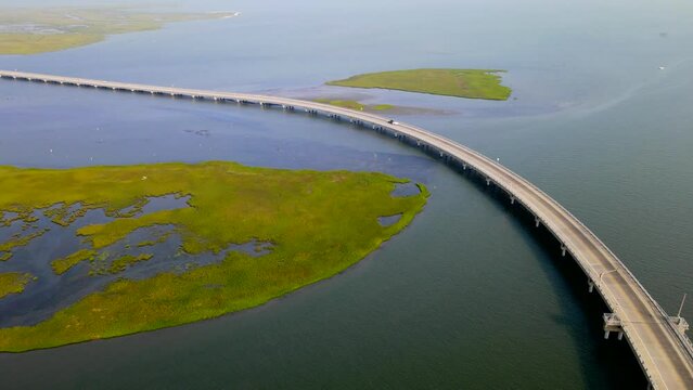 Road through the swamps to the Chincoteague bay nature reserve. Aerial view of the road and the reserve
