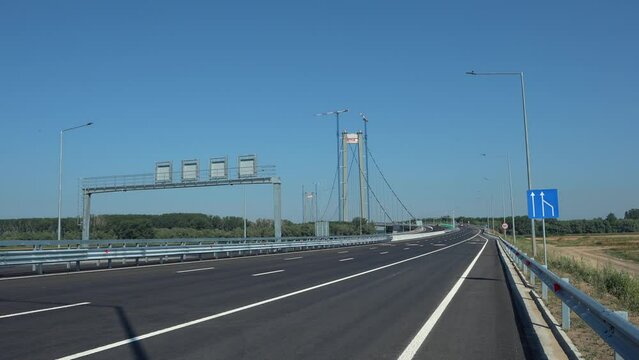 Wide angle 4K video with the suspension bridge in Braila, Romania. The third longest suspended bridge in Europe. Infrastructure industry in Romania.