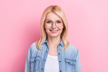 Fototapeta premium Photo of retired healthy charming lady professional beaming smiling wear spectacles jeans shirt isolated pink color background