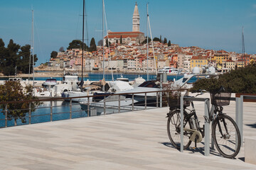 Historic cityscape of Croatian Mediterranean sea coast - old town Rovinj Croatia boats on water and bike for ride in Istria Croatia