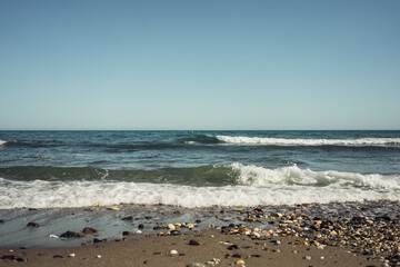 Fototapeta na wymiar Sea surf waves sand stones summer vacation sun vacation