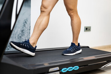 A photo of some legs that are walking on a treadmill for a biomechanical study of the feet....