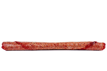 Fruit leather raspberry roll isolated on a white background. Tasty fruit pastille marshmallow.