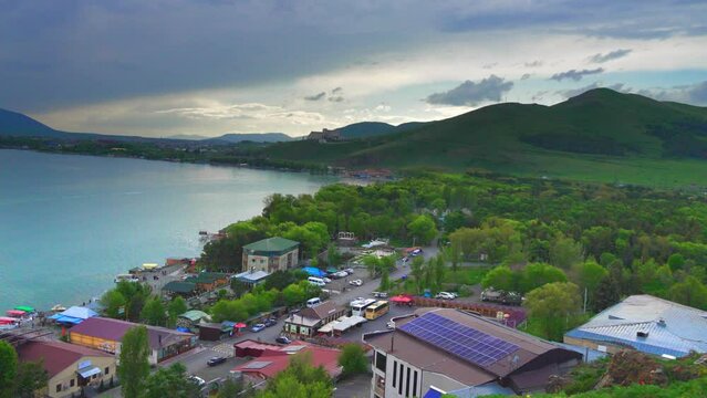 Fantastic evening panorama of alpine Lake Sevan in Armenia. Panoramic view of mountain lake in front of mountain range, national parks of Armenia .