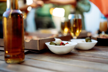 Joyful Gathering of Friends for a Delicious Meal Having fun and Celebrating with Alcoholic Bewerage