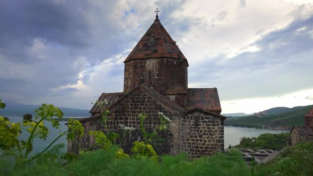 Scenic view of old Sevanavank church in Sevan, Armenia on sunny blue sky day. Sevanavank monastery complex on peninsula on northwestern shore of Lake Sevan in Armenia