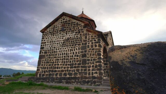 Scenic view of old Sevanavank church in Sevan, Armenia on sunny blue sky day. Sevanavank monastery complex on peninsula on northwestern shore of Lake Sevan in Armenia