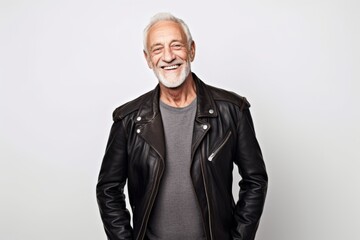 Fototapeta na wymiar Portrait of a smiling senior man in a leather jacket on a white background