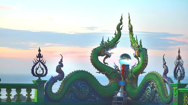 two naga and crystal ball on balcony and sunset cloud on evening