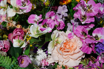 Beautiful multicolored artificial flowers background