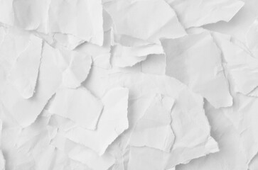 Obraz premium Creative background with scattered overlay of crumpled white paper. 