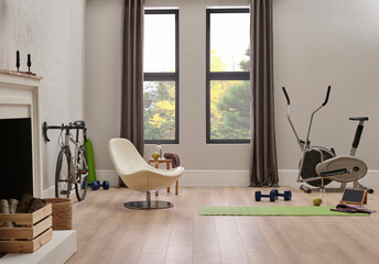 Sport in the home concept with bike and mat, wall chair and room interior style.