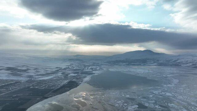 Aerial view of frozen Lake Paravani. The largest lake in Georgia at an altitude of more than 2000 meters.