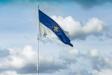 Flag of the city of Ponta Grossa, city of Paraná located in the southern region of Brazil, in a sky with clouds.