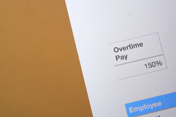 Close-up view of a document showing overtime pay percentage.