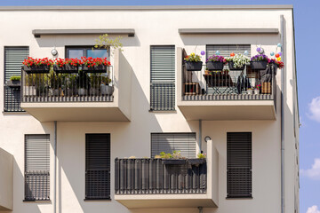 Balcony of Modern Apartment Building. Modern Sunny Balconies with Flowers, Sun Protection Blinds...