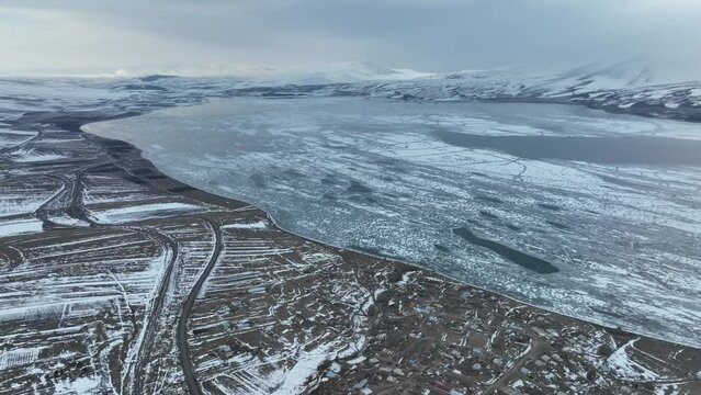 Aerial view of frozen Lake Paravani. The largest lake in Georgia at an altitude of more than 2000 meters.