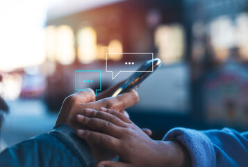 Social media marketing concept. Women hand using smartphone typing, chatting conversation in chat box icons pop up and kid hand try to get attention from mother shopping online or using internet