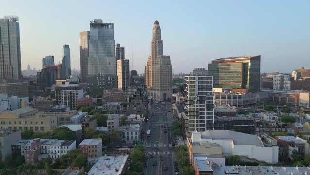 flying over Fourth Ave. in Brooklyn towards One Hanson Place building