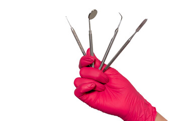 Close-up dentist hands in medical gloves hold dentistry tools, mirror isolated over white...