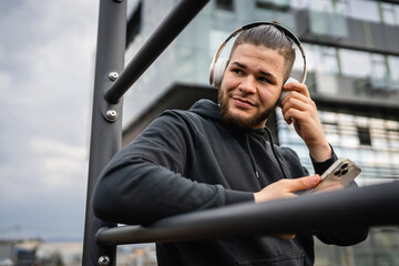 One man caucasian young male stand at outdoor open training park gym