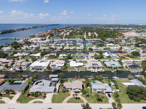 Aerial view of a Florida barrier island community with canals.