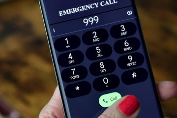 Dialing 999 Emergency services Call on mobile cell phone - police, fire department rescue EMT
