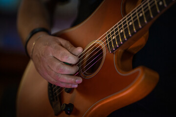 Musician's hand on guitar