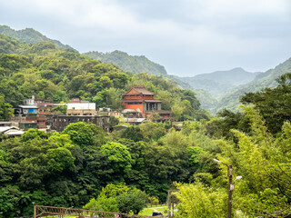 Fototapeta na wymiar Landscape view from Houtong cat village, near Taipei in Taiwan, forest, mountains and cloudy sky in summer