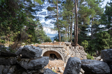 Fototapeta na wymiar Kitanaura is an ancient Lycian city, in the mountains above Kemer, Antalya, Turkey. The city has been archaeologically explored by the University of Antalya, but not excavated. 